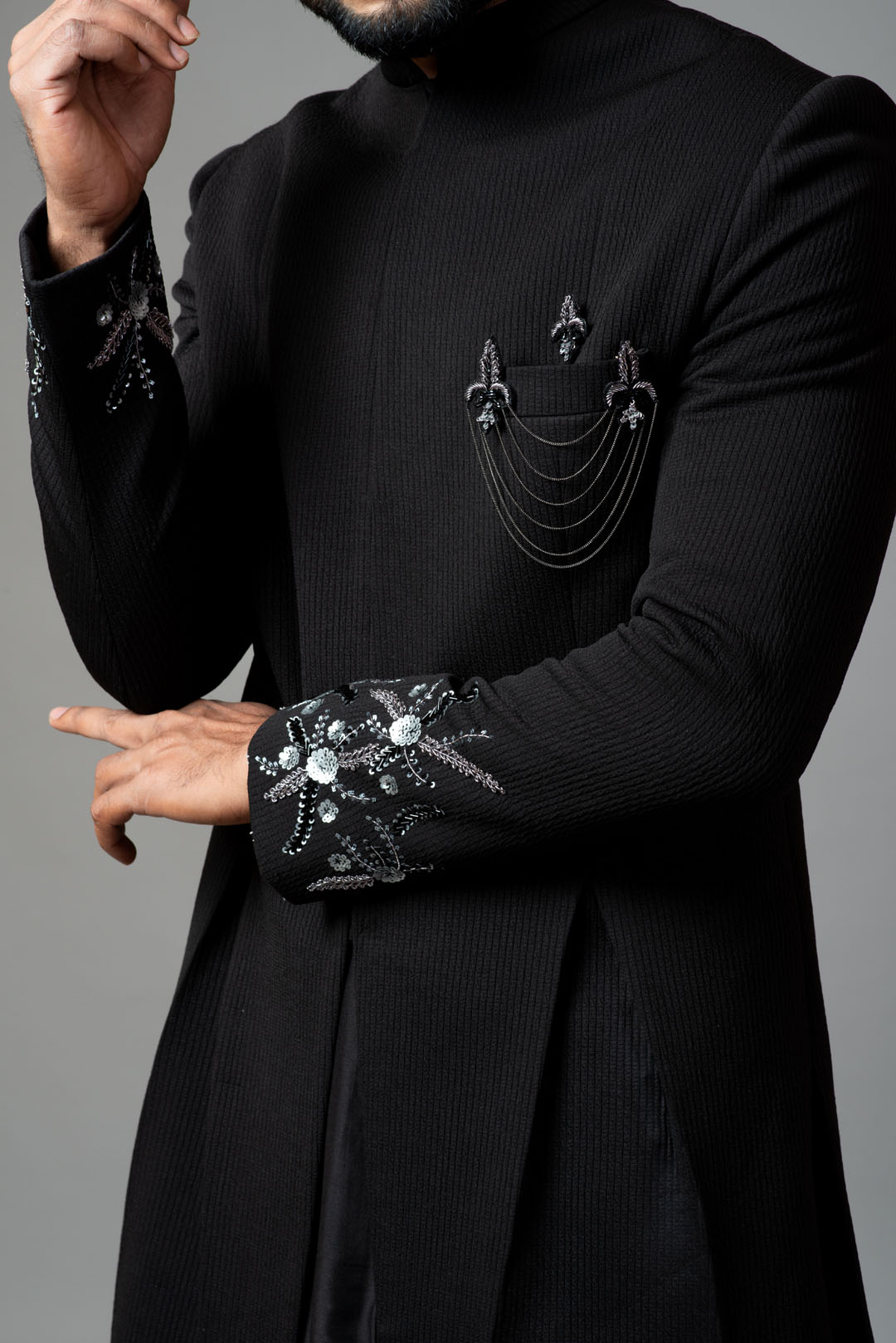Achkan with slight embroidery on sleeves comes with Anarkali kurta