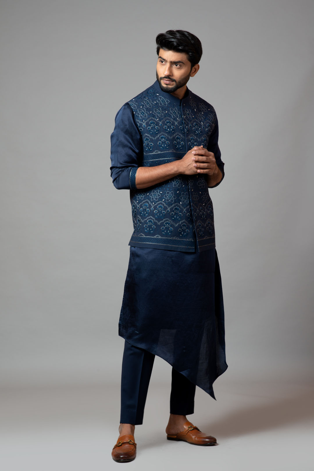 Navy Blue Kora Nehru jacket with Mughal inspired embroidery paired with a drape kurta
