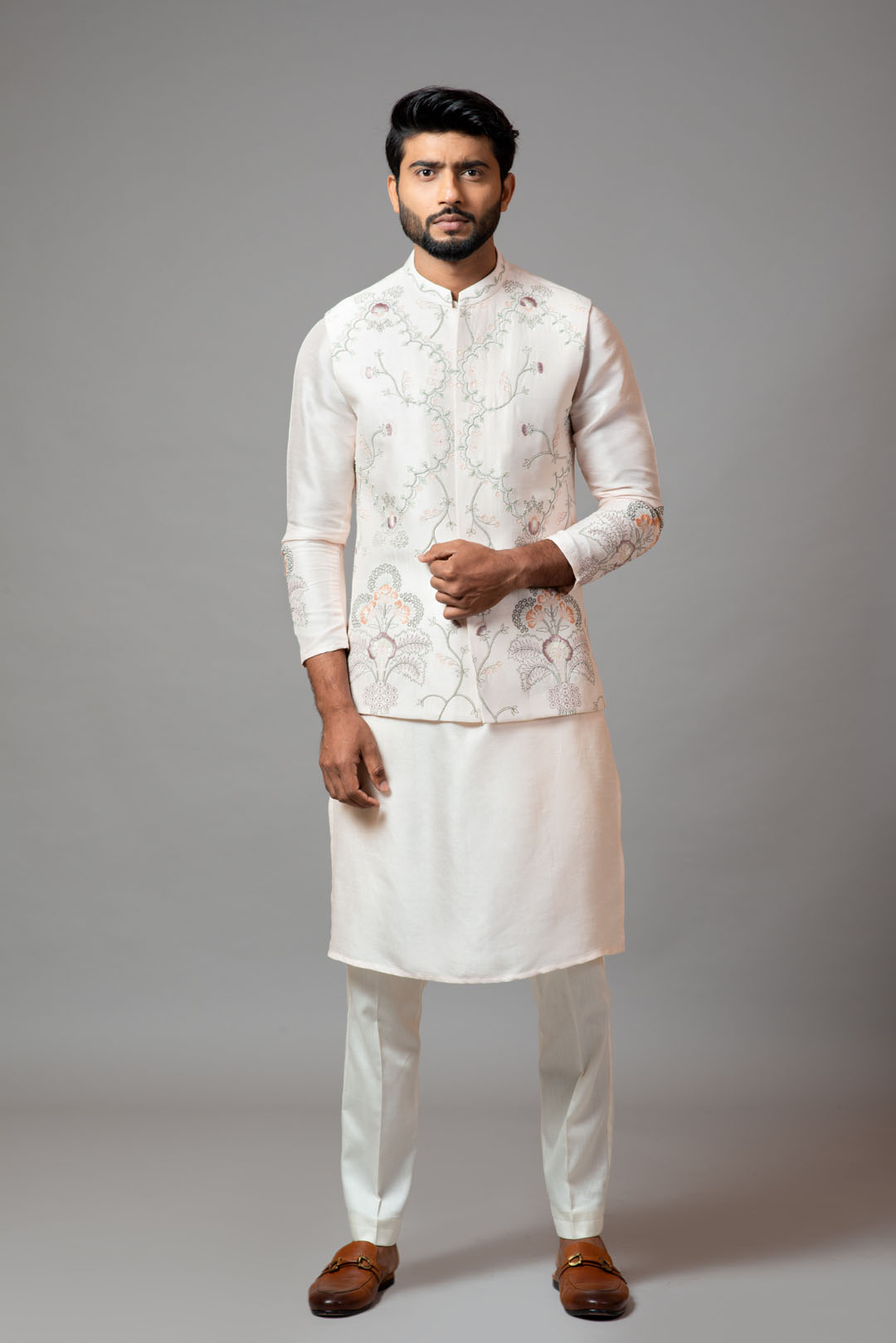 Plain kurta with minimal floral embroidery on sleeves